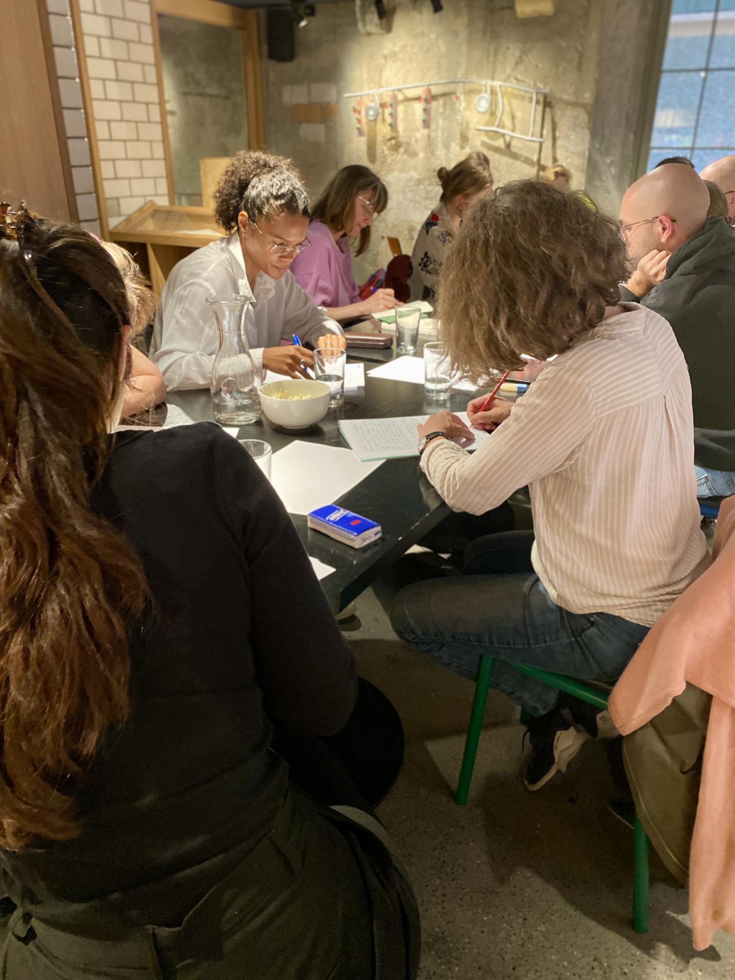 close-up of people thinking and writing